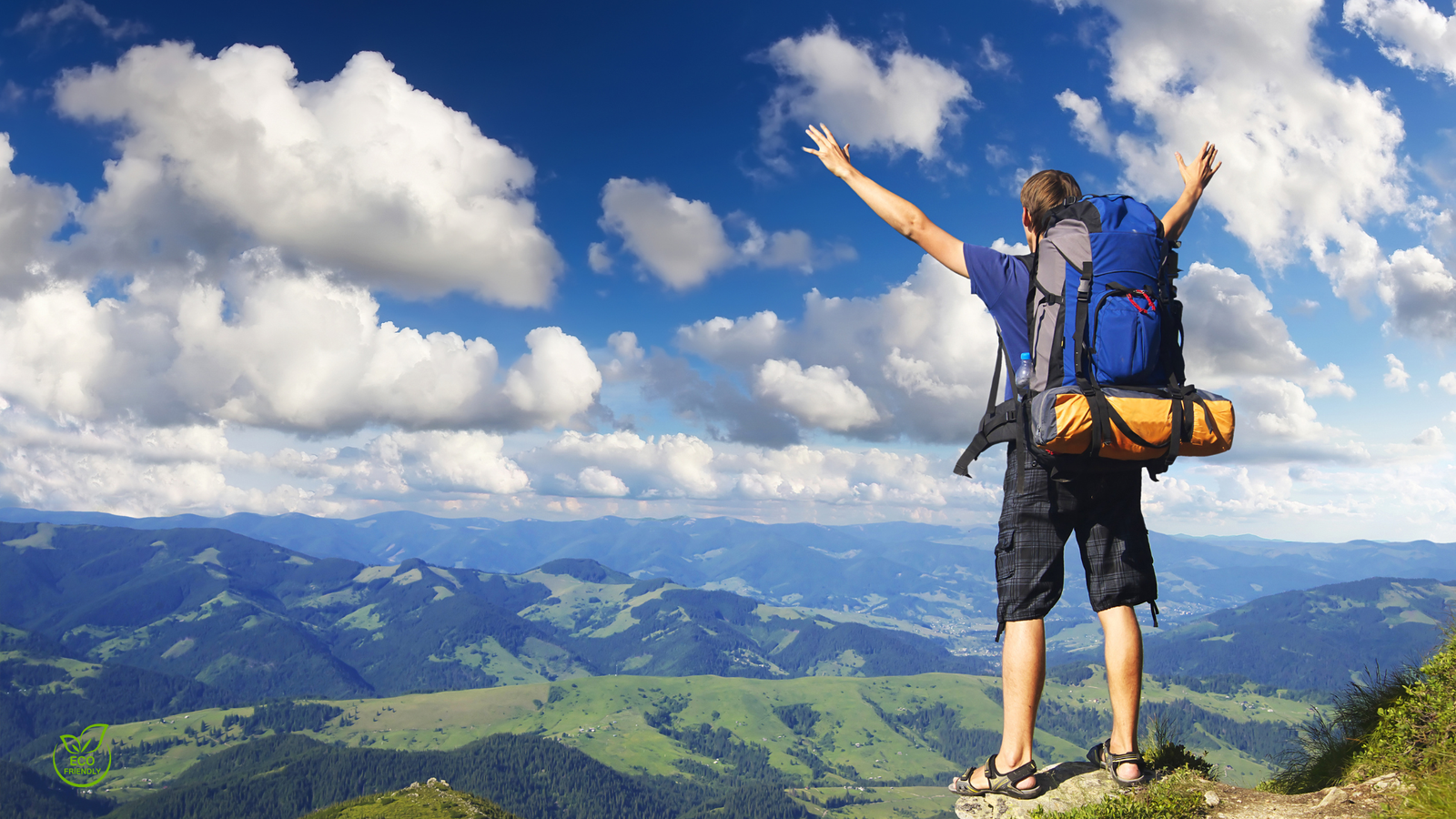 Eco traveler hiking through mountains — ecotourism 2025 guide